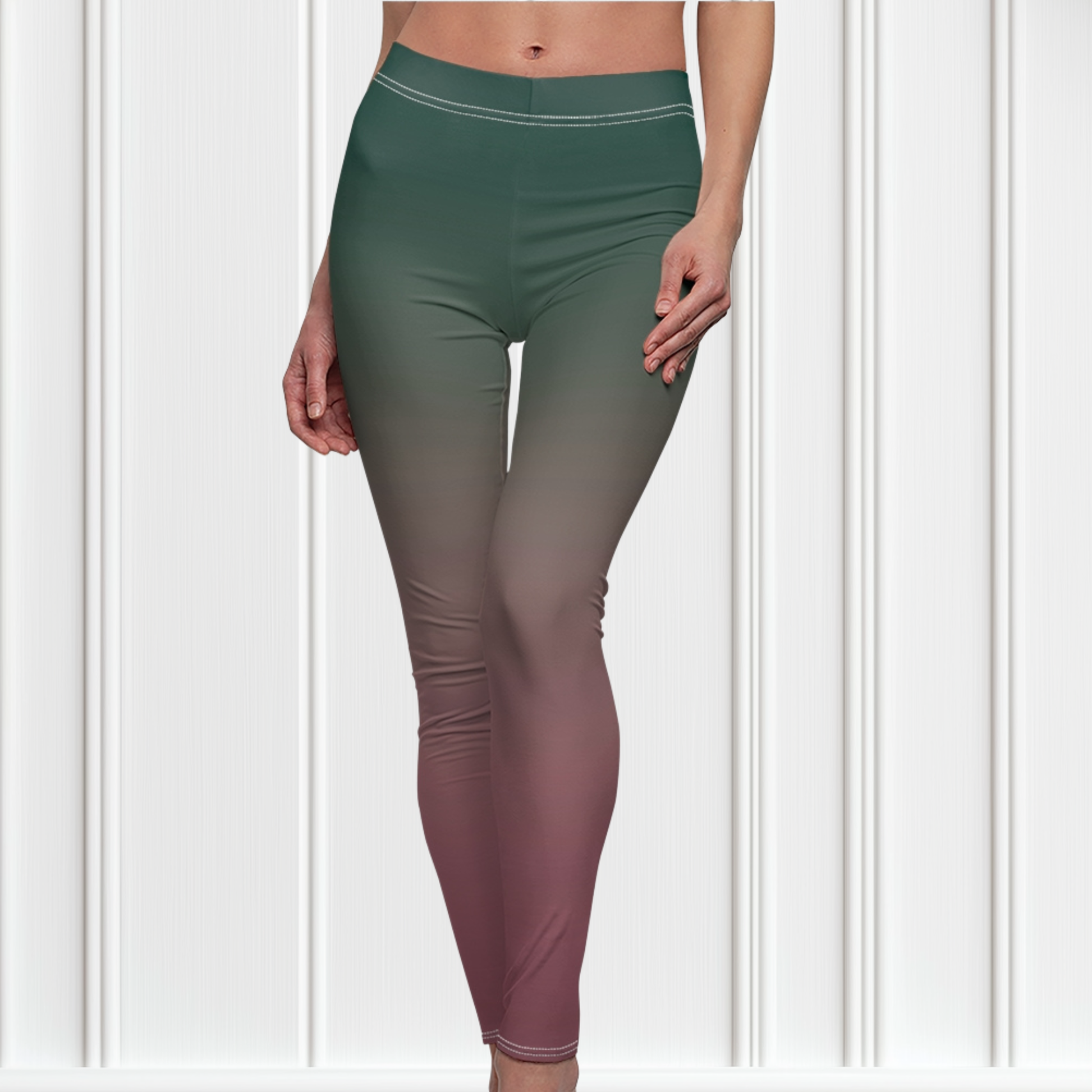 A pair of custom handmade high waisted women's leggings with an ombre pattern that starts as an emerald green at the top then fades to a light purple, then to a deep purple at the ankle of the pant.