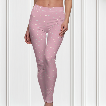 These women's leggings are a dusty rose color with there being little beige flowers all over the entire pair of leggings.