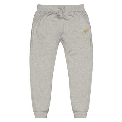 A pair of super soft fleece unisex sweatpants with a bumble bee embroidered in gold over the left front pocket of the pants.
