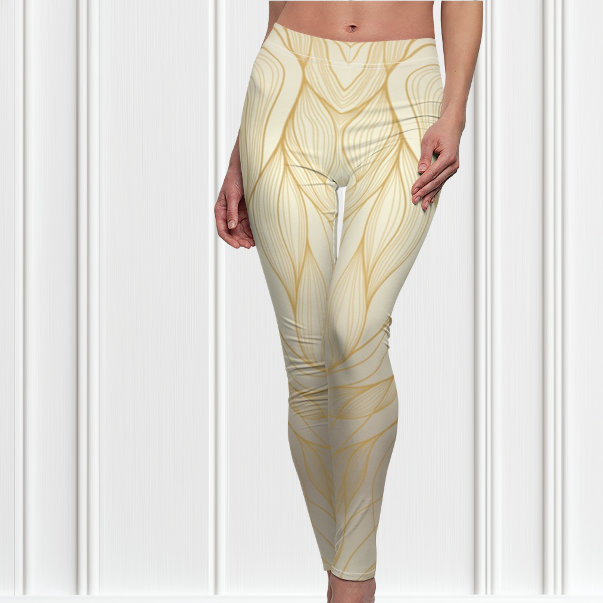 These custom women's high waisted leggings have a base color of a light beige  that fades to a even brighter beige at points to give off a 3D wave design, there are gold lines overlayed across the top of the beige that contour to the body.