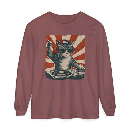 On the front of this custom retro long sleeve shirt is a DJ playing music, except the DJ is a cat that is wearing headphones, there is a vintage red and ivory background behind the cat.