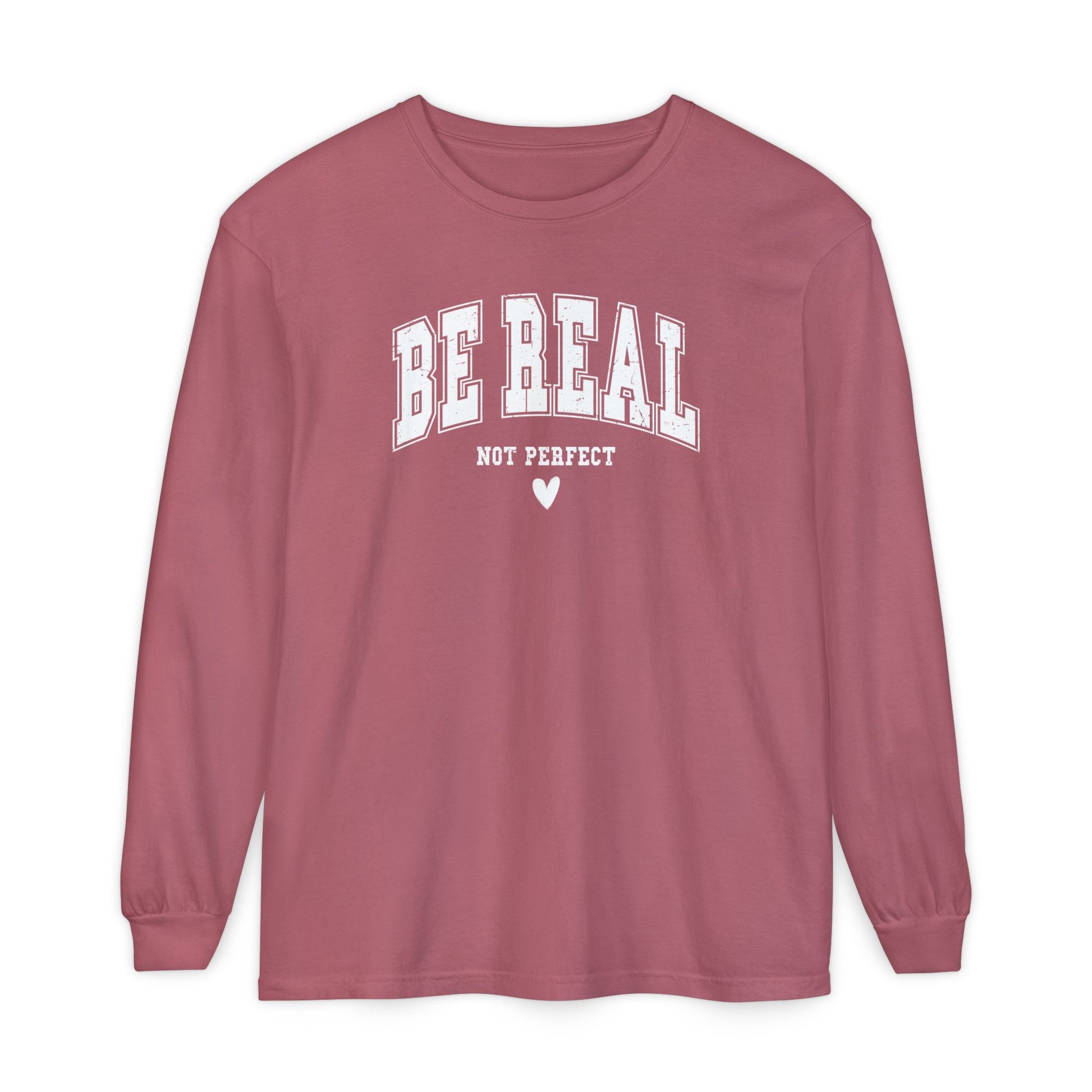 On the front of this custom unisex long sleeve shirt are the words Be Real in large bubble font with the words not perfect underneath the bubble letters, on the bottom there is a heart.