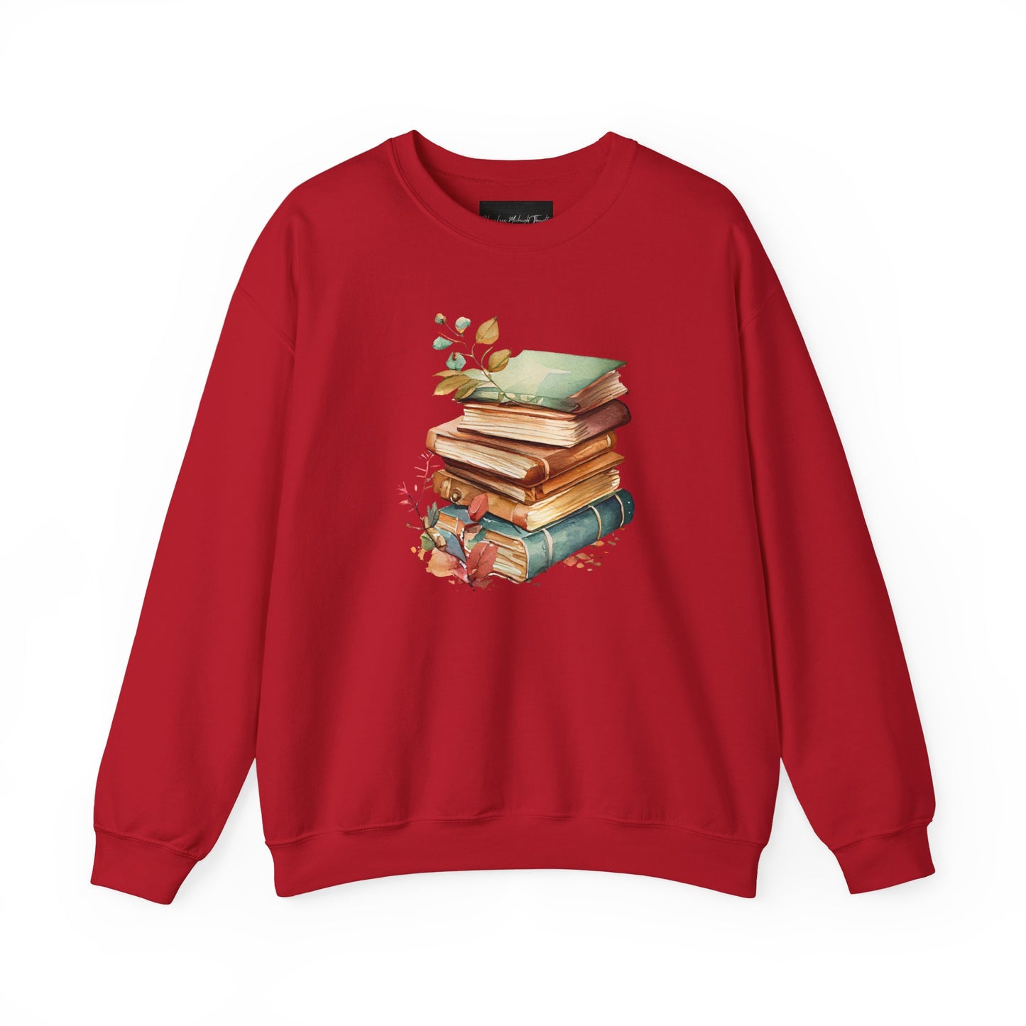 On the front of this custom book lovers sweatshirt is a stack of vintage books with a bunch of wildflowers all around the books.