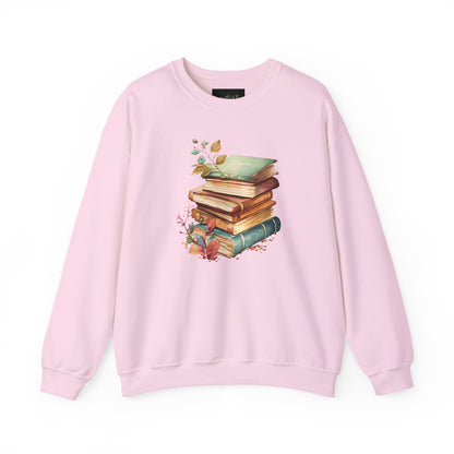 On the front of this custom book lovers sweatshirt is a stack of vintage books with a bunch of wildflowers all around the books.