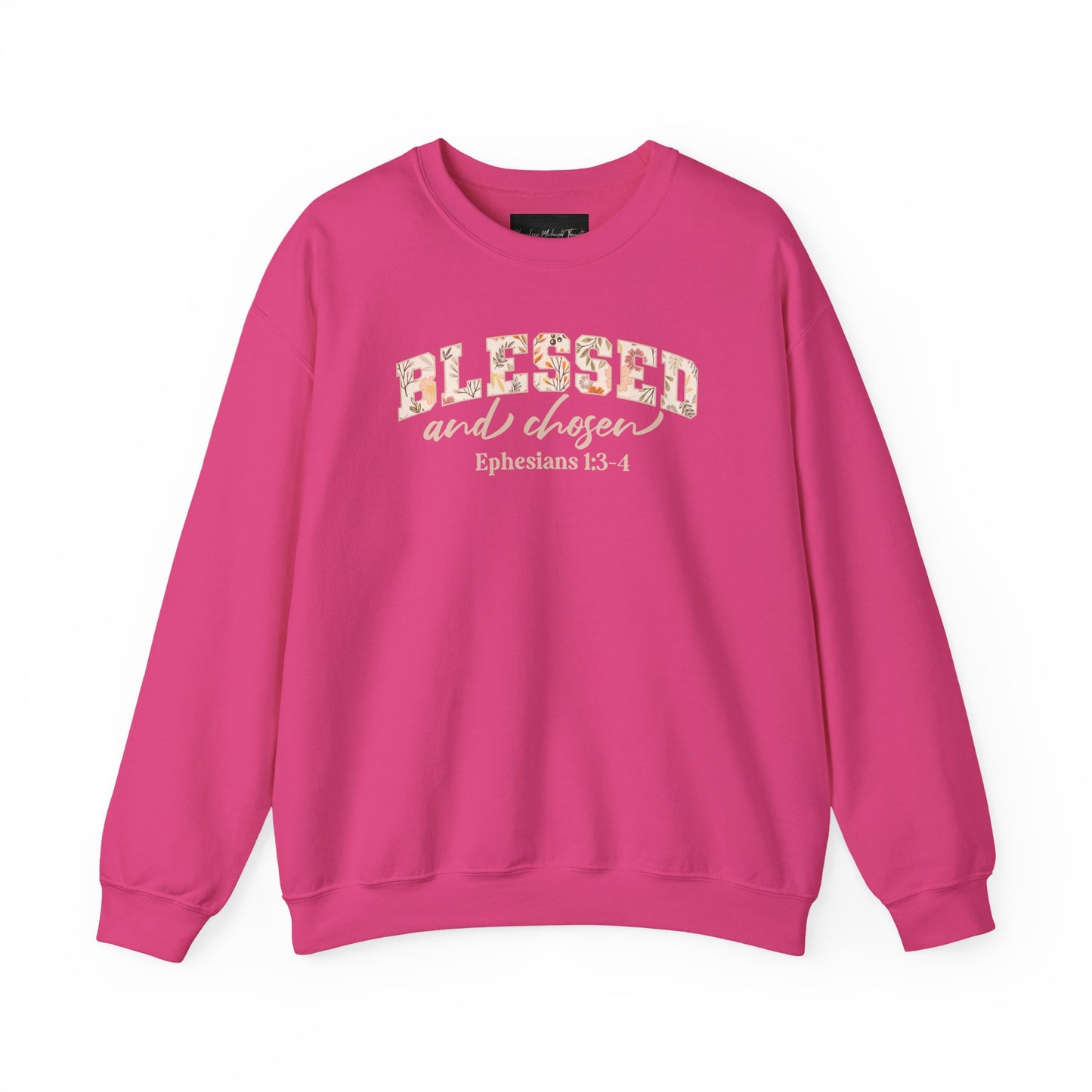 On the front of this custom Christian sweatshirt is the bible verse Blessed and Chosen Ephesians 1:3-4 with the word Blessed being in large bubble letters with a floral pattern on the inside of the letters.