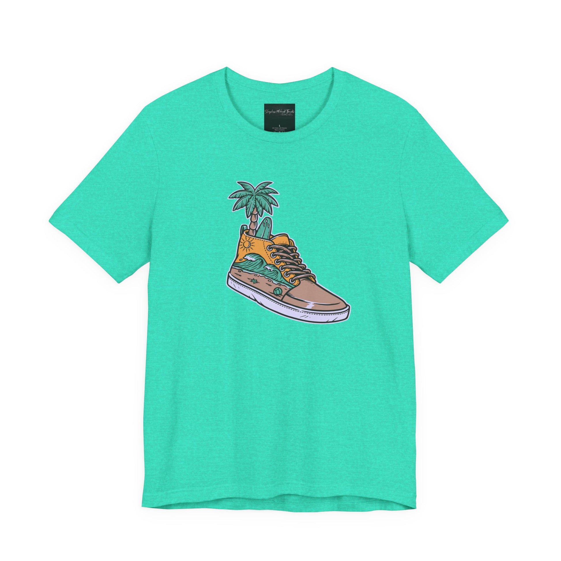 On the front of this custom handmade short sleeve shirt is an image of a high top running shoe with ocean waves running along the side of the shoe, coming out of the top of the shoe where your foot goes is a palm tree and a surf board.