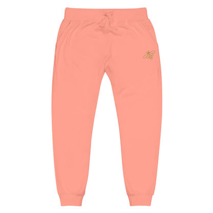 A pair of super soft fleece unisex sweatpants with a bumble bee embroidered in gold over the left front pocket of the pants.
