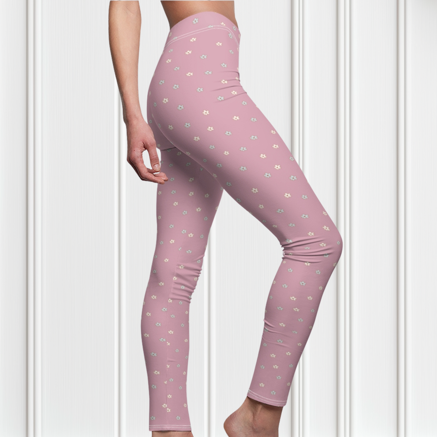 These women's leggings are a dusty rose color with there being little beige flowers all over the entire pair of leggings.