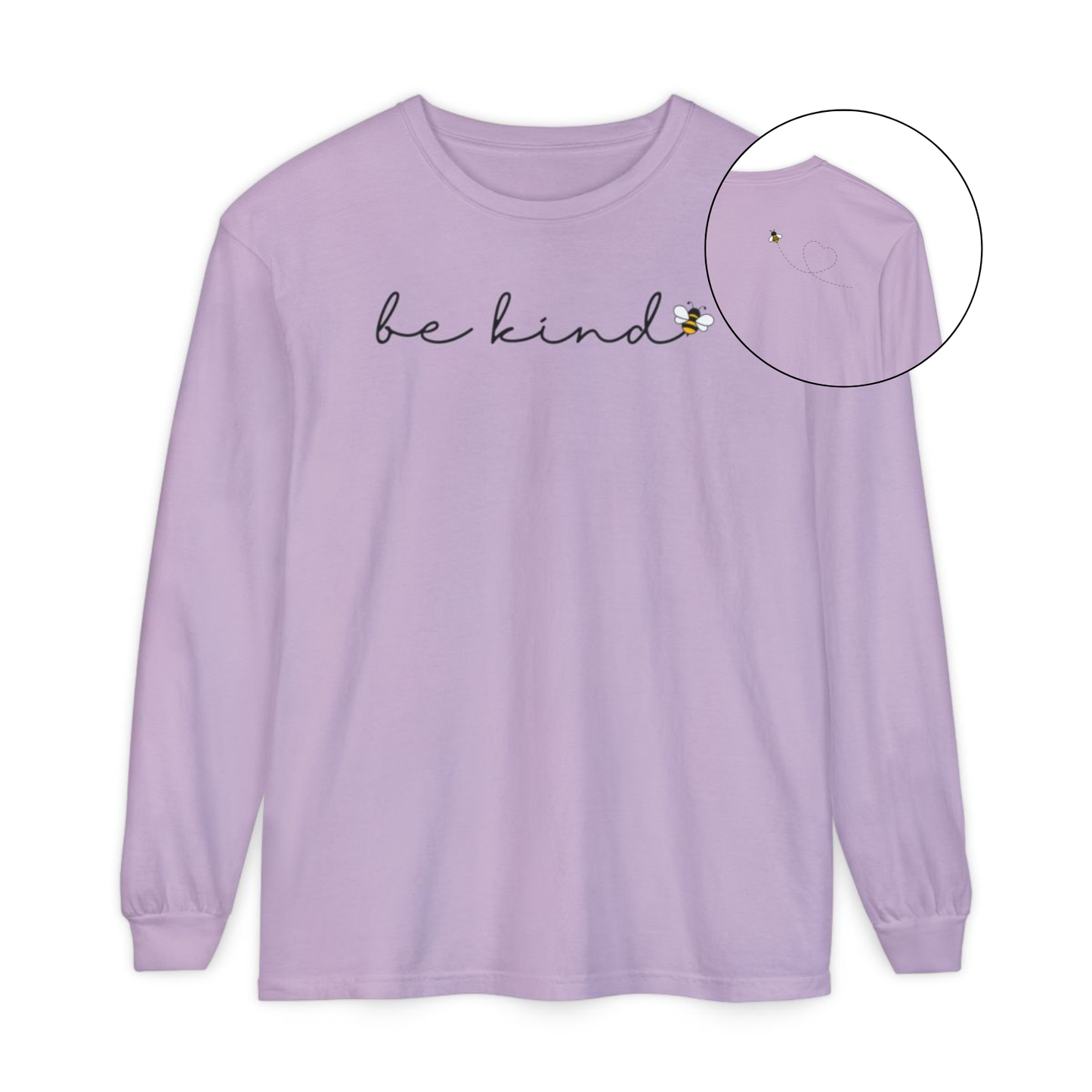 On the front of this custom unisex long sleeve shirt are the words be kind in a simple cursive font, with a bumble bee on the right side of the letter kind, on the back right shoulder there is an image of a bumble bee flying and leaving a trail behind it in the shape of a heart.