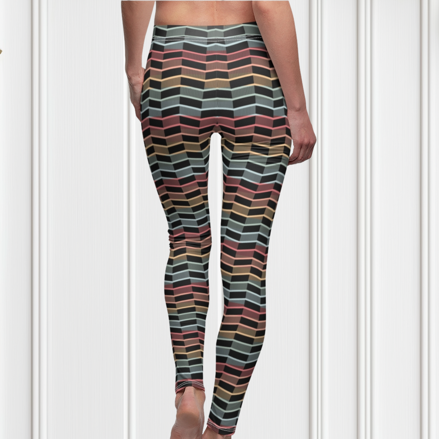 Custom women's leggings with rows of pastel red, yellow and blue from the top to the bottom of the leggings, there is a black abstract pattern overtop of the colors giving the leggings a 3D look.