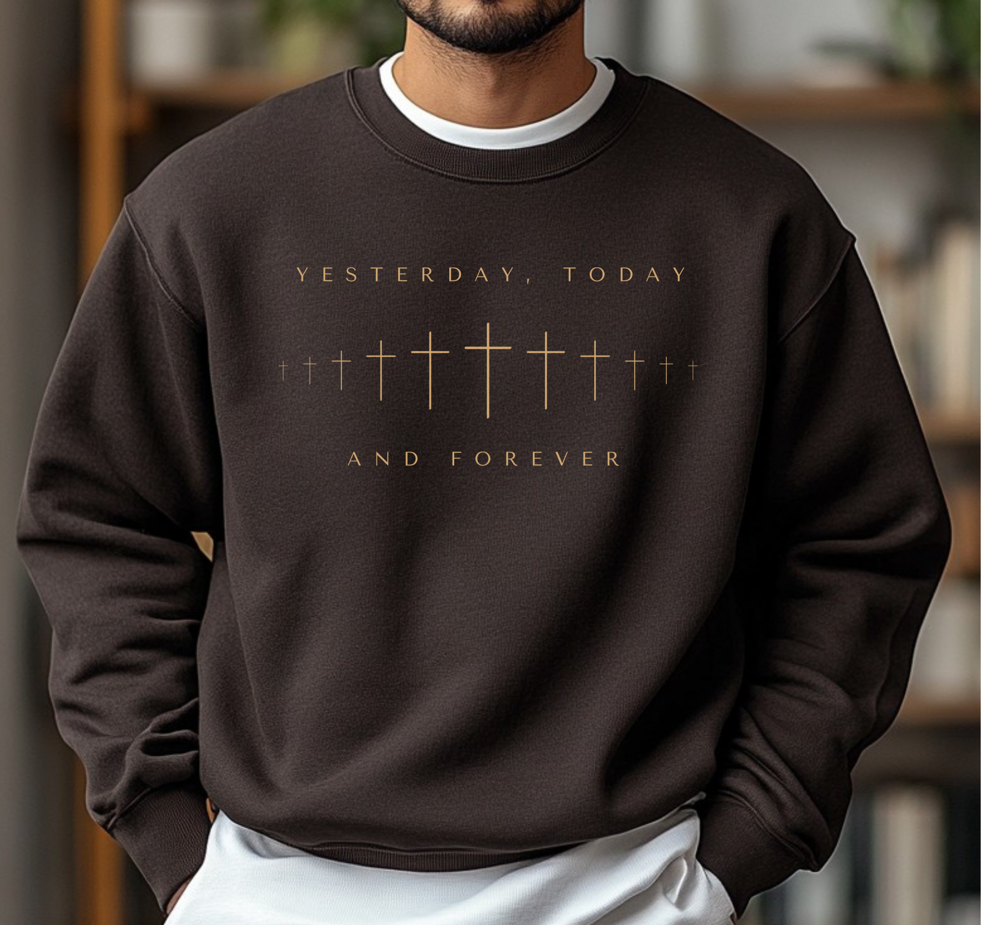 On the front of this Christian pullover sweatshirt is a row of Jesus crosses that look like they are fading into the distance, the words Yesterday, Today and Forever are on the top and the bottom of the crosses.