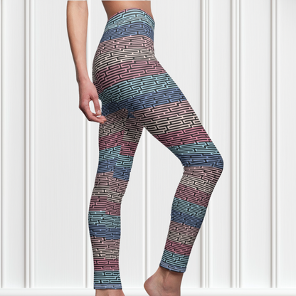 Custom women's high waisted leggings with rows of pastel red, yellow and blue from the top to the bottom of the leggings, there is a black abstract pattern overtop of the colors giving the leggings a 3D look.