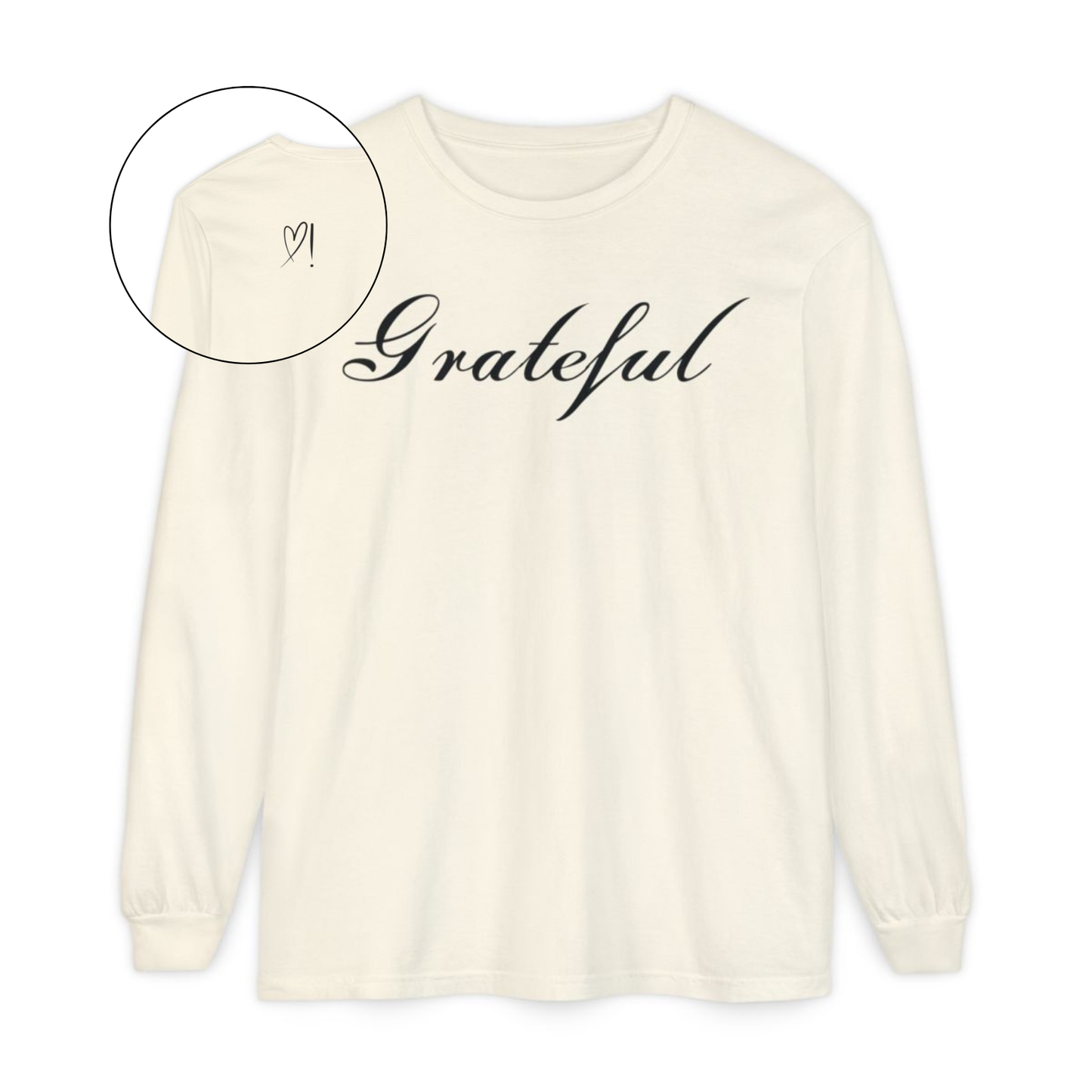 On the front of this custom long sleeve t-shirt in cursive writing is the word grateful on the upper chest, on the back left shoulder blade is an image of a heart with an exclamation mark next to it.