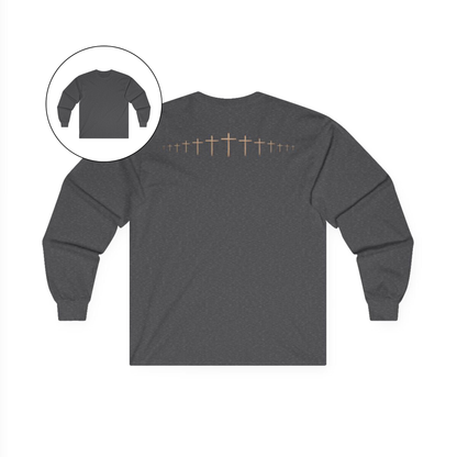 On the back of this grey colored Christian long sleeve shirt is a large wooden Jesus cross in between the shoulder blades, the Jesus cross then keeps getting smaller and smaller till it fades right off the shirt giving it a amazing 3D look on the back.