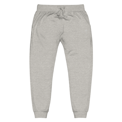 A pair of super soft ankle length Christian unisex sweatpants, there are two pockets on the front and one pocket on the back right, on the front left pocket is a embroidered white cross.