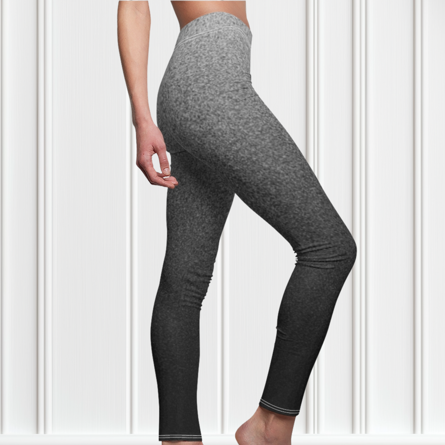 the women's high waisted custom leggings has a ombre static pattern with the top of the pants being a light grey with black static going through it to the bottom of the leggings being black and grey static going through it.