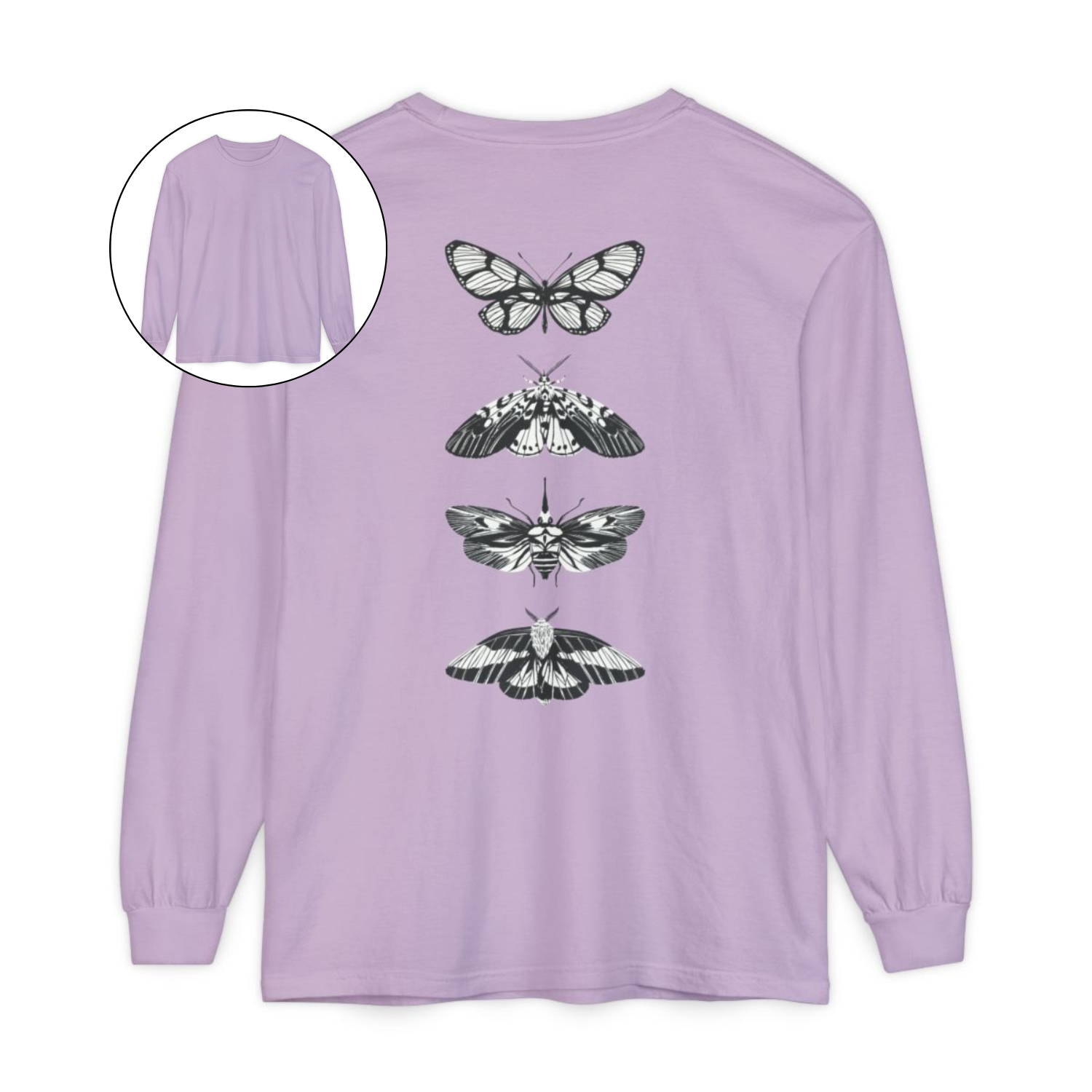 On the back of this long sleeve women's shirt right in between the shoulder blades is a row of black and white butterflies, starting at the top of the back and headed to the bottom of the shirt.