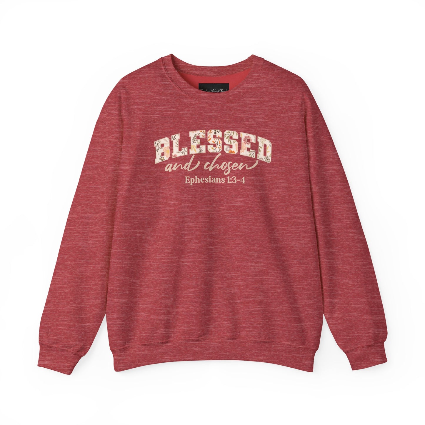 On the front of this custom Christian sweatshirt is the bible verse Blessed and Chosen Ephesians 1:3-4 with the word Blessed being in large bubble letters with a floral pattern on the inside of the letters.