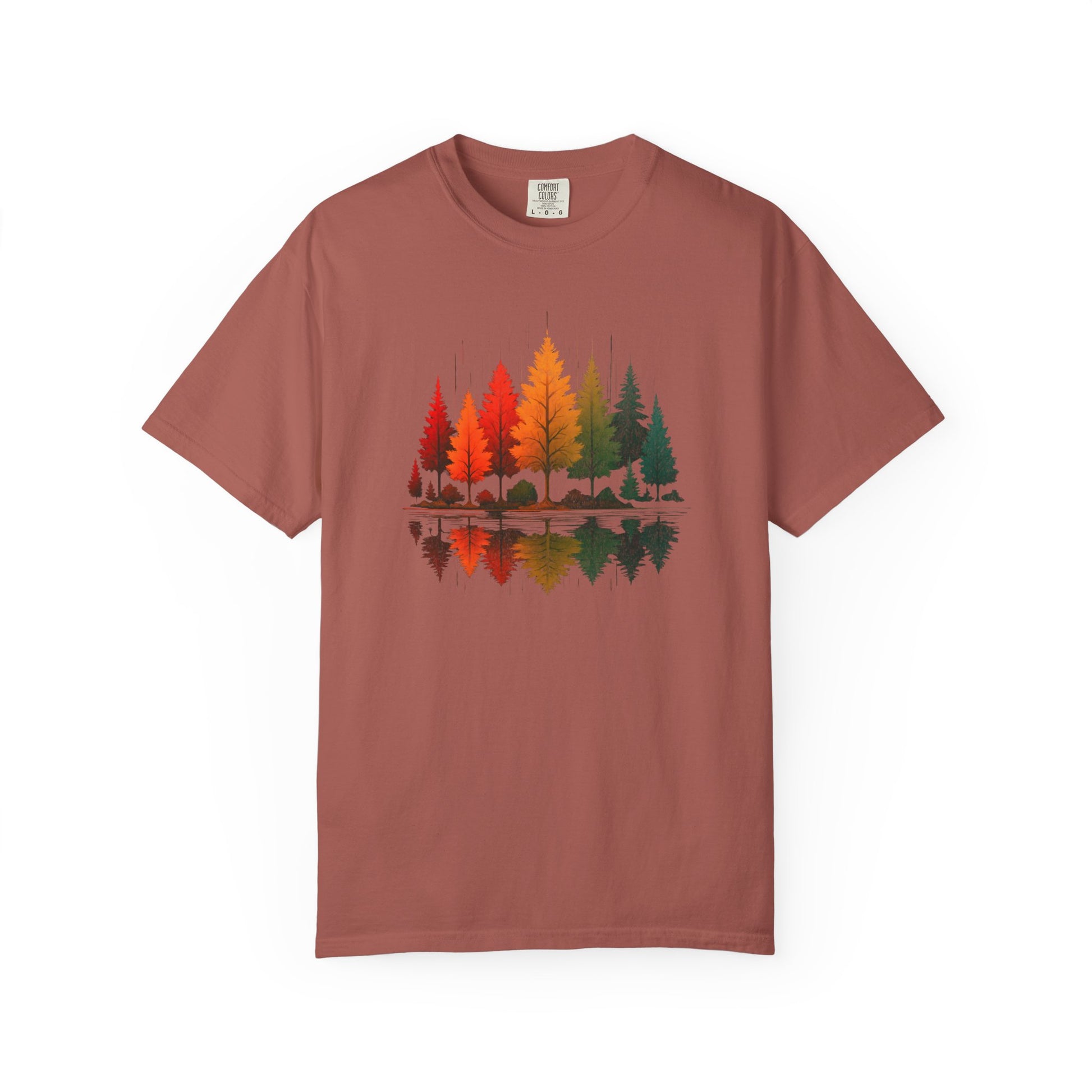 On the front of this custom comfort colors short sleeve shirt is a image of trees in the fall time with all the different fall colors, the trees reflection is right underneath making them look like they are above water.