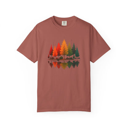 On the front of this custom comfort colors short sleeve shirt is a image of trees in the fall time with all the different fall colors, the trees reflection is right underneath making them look like they are above water.