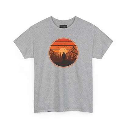 On the front of this custom tee is a large circle on the center of the chest that has an image of bigfoot right in the middle, there is a sun setting with mountain ranges and pine trees in the background.