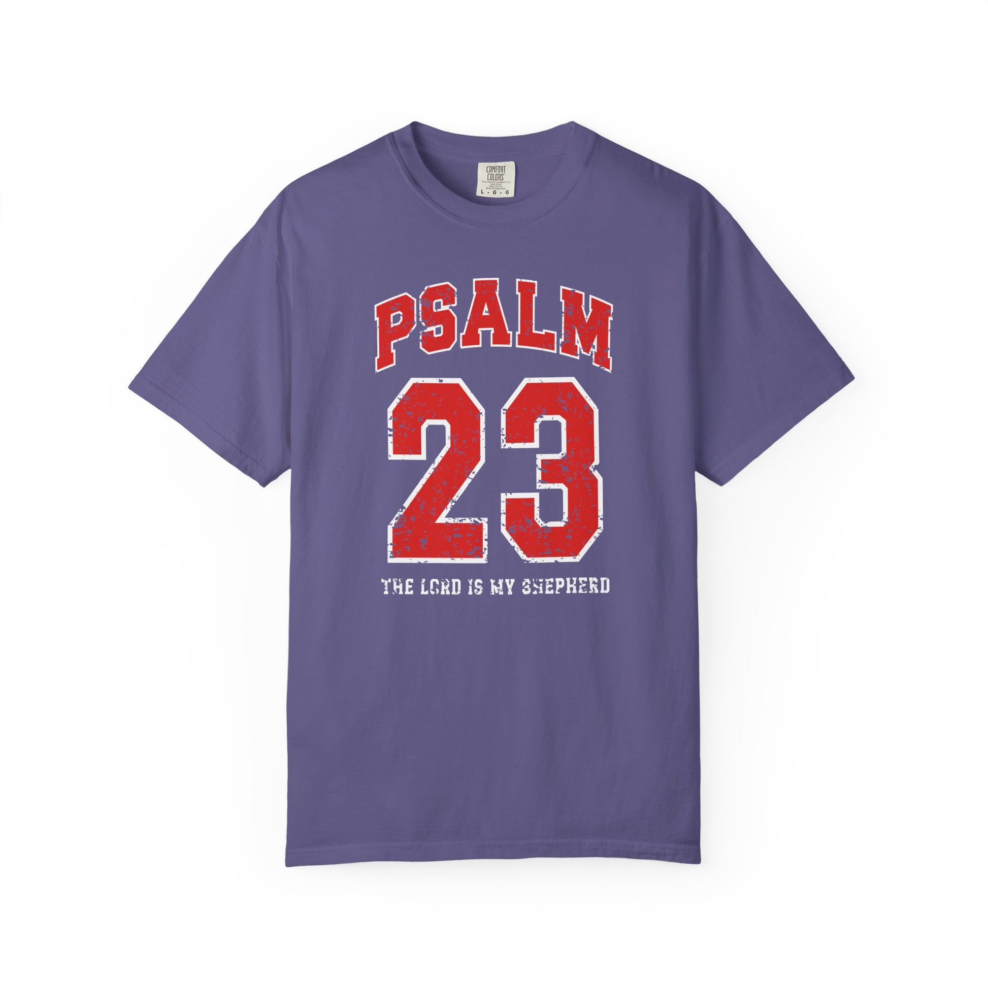 On the front side of this custom vintage t-shirt are the words Psalm 23 The Lord Is My Shepherd, it is with red and white block lettering.