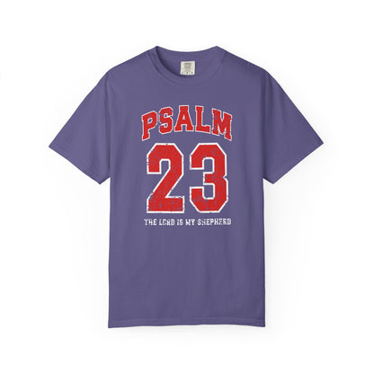 On the front side of this custom vintage t-shirt are the words Psalm 23 The Lord Is My Shepherd, it is with red and white block lettering.