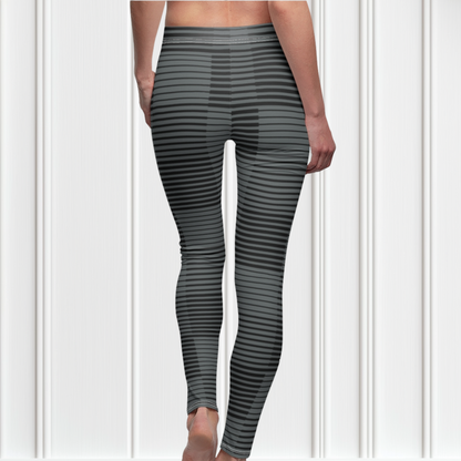 A pair of women's high waisted Christian themed leggings, the pants are light grey  color with black stripes running across the pants, the lines are in different thicknesses from the top to the bottom ankle of the leggings giving it a 3D look when worn, there is a white Jesus cross on the bottom right calf of the pant.