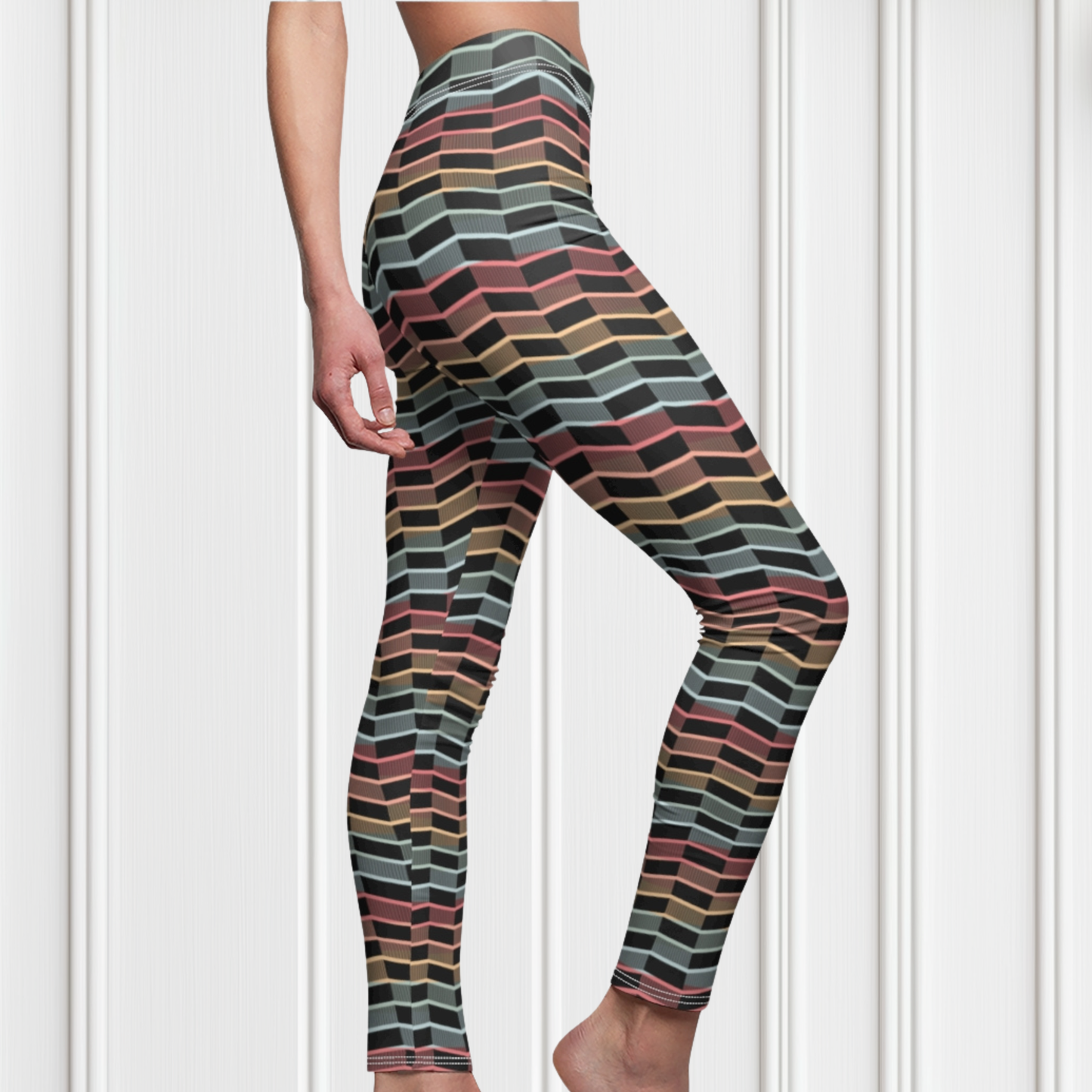 Custom women's leggings with rows of pastel red, yellow and blue from the top to the bottom of the leggings, there is a black abstract pattern overtop of the colors giving the leggings a 3D look.