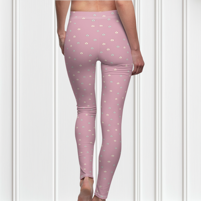 These women's leggings are a dusty rose color with there being little beige flowers all over the entire pair of leggings.