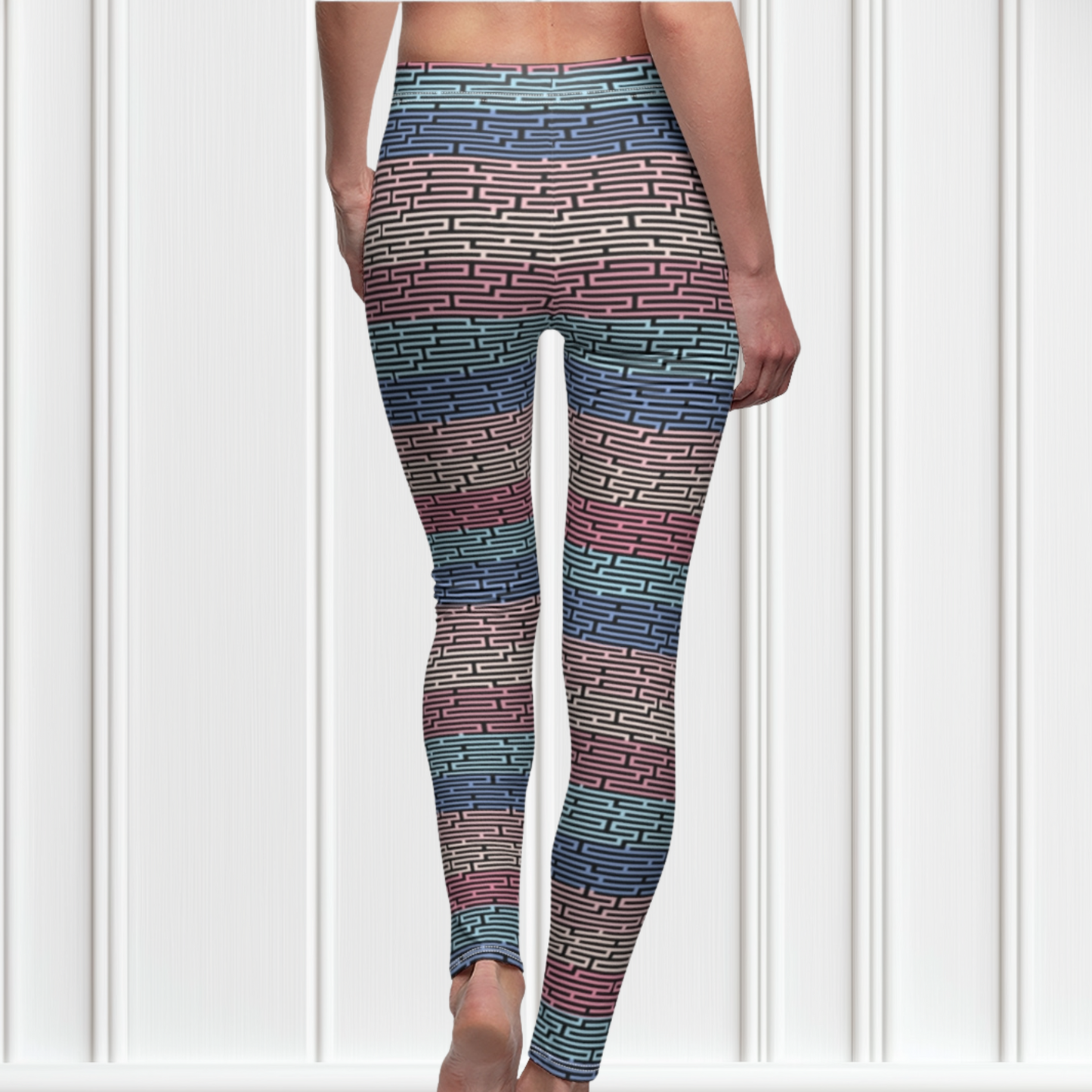 Custom women's high waisted leggings with rows of pastel red, yellow and blue from the top to the bottom of the leggings, there is a black abstract pattern overtop of the colors giving the leggings a 3D look.