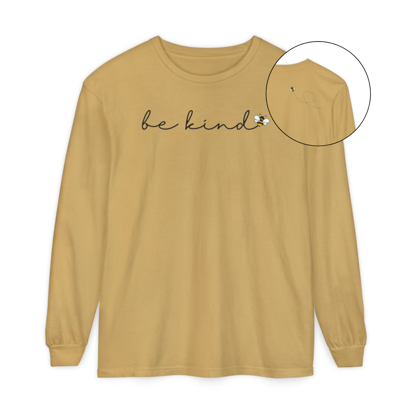 On the front of this custom unisex long sleeve shirt are the words be kind in a simple cursive font, with a bumble bee on the right side of the letter kind, on the back right shoulder there is an image of a bumble bee flying and leaving a trail behind it in the shape of a heart.