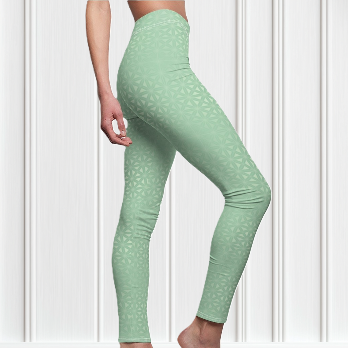 These high waisted women's leggings are a light green with a geometric pattern overlayed overtop, some spots are brighter than others showcasing some spots more than others.