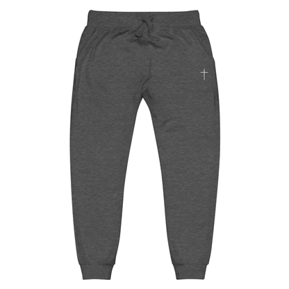 A pair of super soft ankle length Christian unisex sweatpants, there are two pockets on the front and one pocket on the back right, on the front left pocket is a embroidered white cross.
