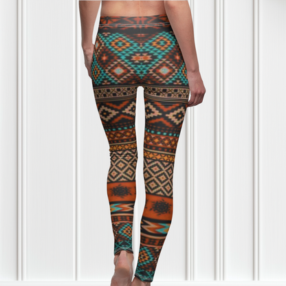 A pair of super soft handmade women's ankle length high waisted leggings. The pattern throughout the entire pair of pants is a orange, brown and blue Aztec pattern from the top of the pants to the bottom of the leggings.