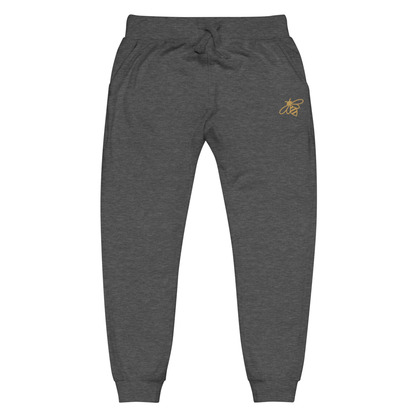 A pair of super soft fleece unisex sweatpants with a bumble bee embroidered in gold over the left front pocket of the pants.