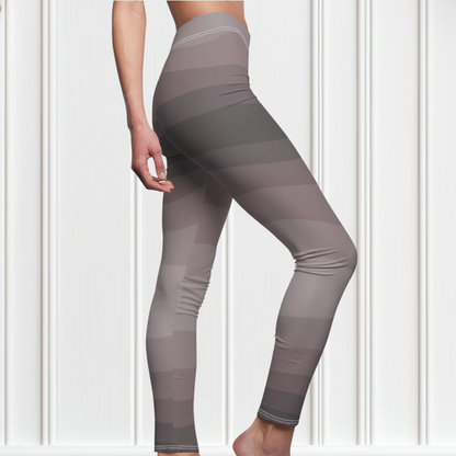 Custom high waisted women's leggings that have a wavy lines pattern that are all different shades of grey.