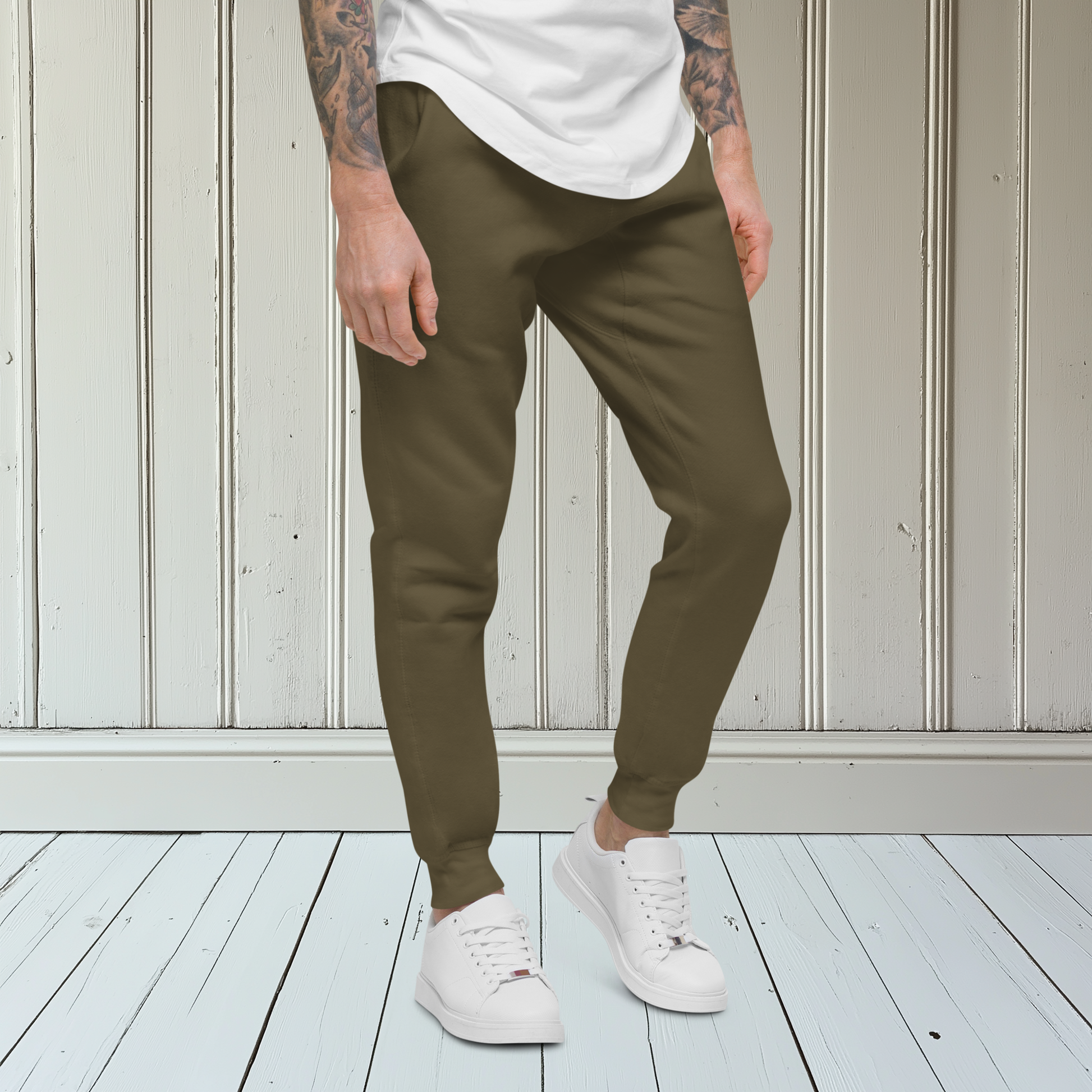 A pair of super soft ankle length unisex sweatpants, there are two pockets on the front and one pocket on the back right, the word warrior is in gold on the back left leg from the knee down and a male lion with a crown on the other