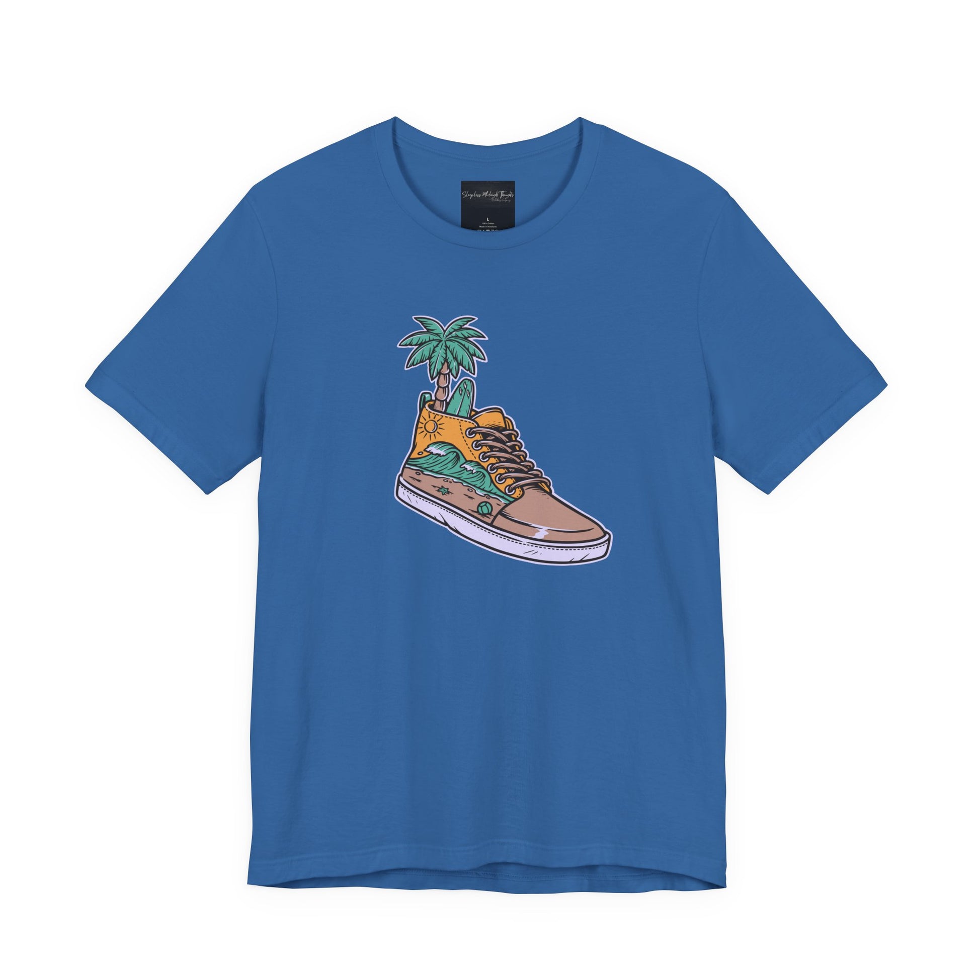 On the front of this custom handmade short sleeve shirt is an image of a high top running shoe with ocean waves running along the side of the shoe, coming out of the top of the shoe where your foot goes is a palm tree and a surf board.