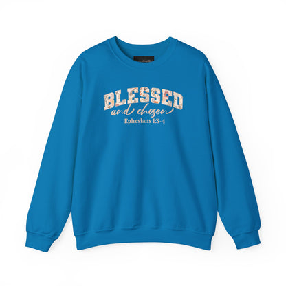 On the front of this custom Christian sweatshirt is the bible verse Blessed and Chosen Ephesians 1:3-4 with the word Blessed being in large bubble letters with a floral pattern on the inside of the letters.
