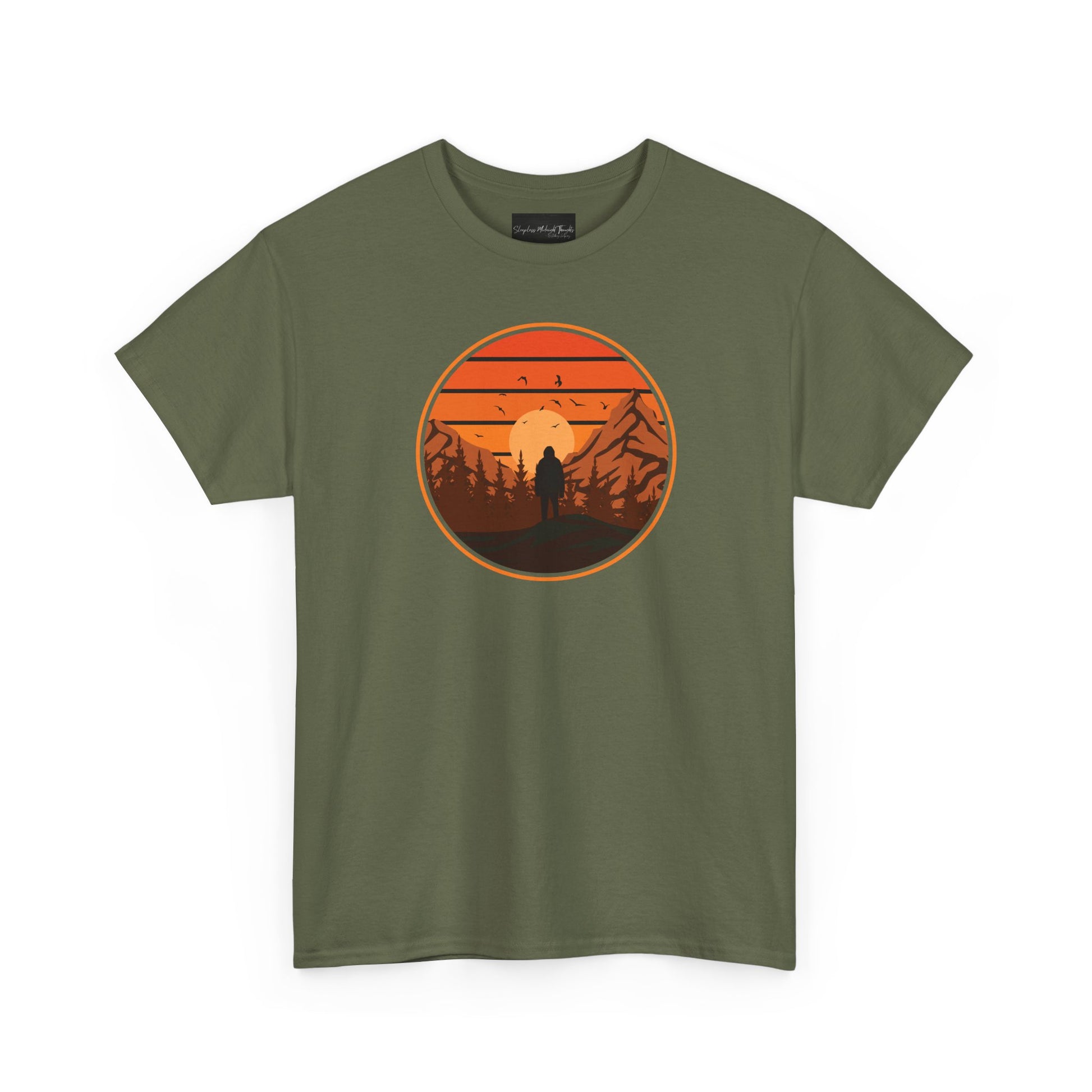 On the front of this custom tee is a large circle on the center of the chest that has an image of bigfoot right in the middle, there is a sun setting with mountain ranges and pine trees in the background.