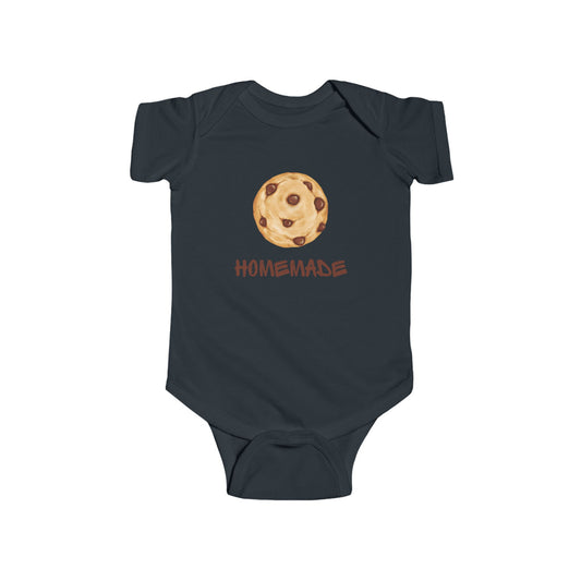 This adorable custom super soft baby onesie that features an image of a chocolate chip cookie in the middle with the word 'homemade' in brown writing underneath the image.