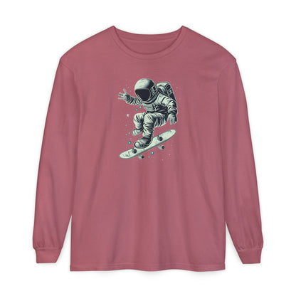 On the front of this custom unisex long sleeve shirt is an image of an astronaut riding a skateboard, there are a bunch of stars around the astronaut.