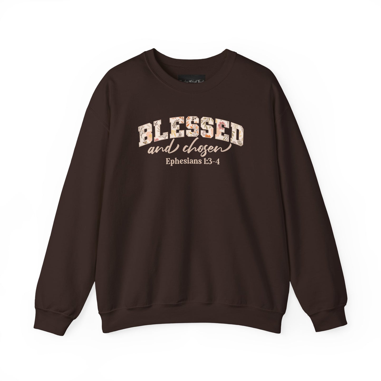 On the front of this custom Christian sweatshirt is the bible verse Blessed and Chosen Ephesians 1:3-4 with the word Blessed being in large bubble letters with a floral pattern on the inside of the letters.