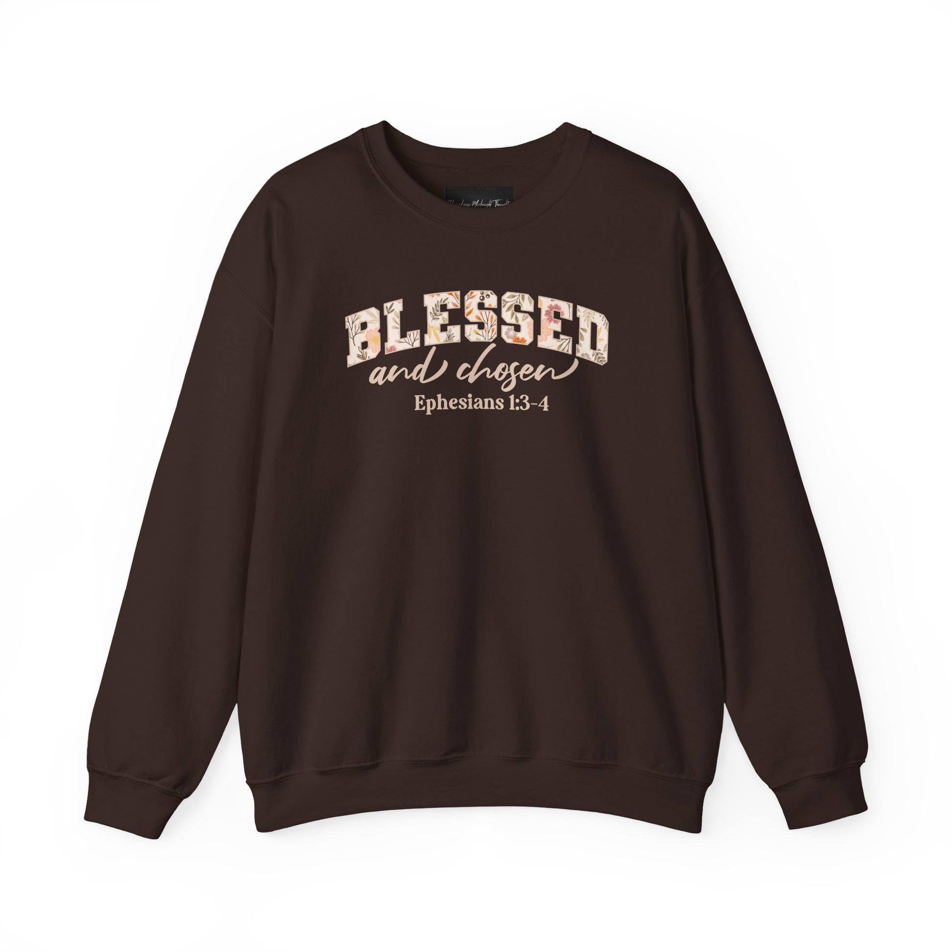 On the front of this custom Christian sweatshirt is the bible verse Blessed and Chosen Ephesians 1:3-4 with the word Blessed being in large bubble letters with a floral pattern on the inside of the letters.
