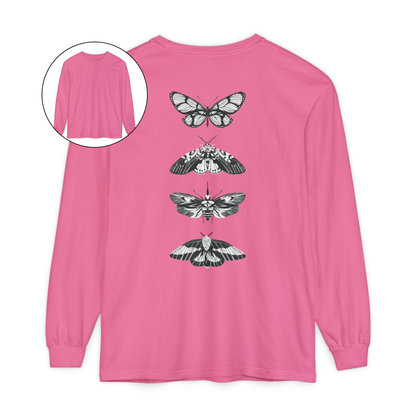 On the back of this long sleeve women's shirt right in between the shoulder blades is a row of black and white butterflies, starting at the top of the back and headed to the bottom of the shirt.