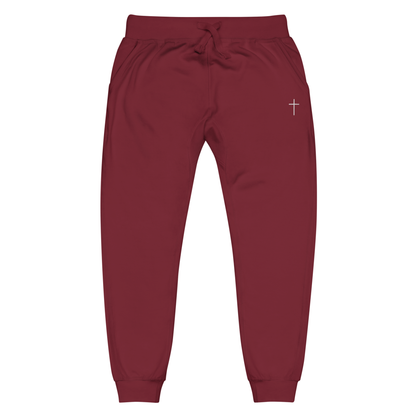 A pair of super soft ankle length Christian unisex sweatpants, there are two pockets on the front and one pocket on the back right, on the front left pocket is a embroidered white cross.
