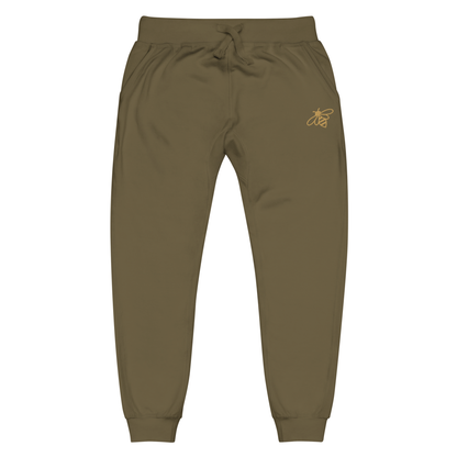 A pair of super soft fleece unisex sweatpants with a bumble bee embroidered in gold over the left front pocket of the pants.