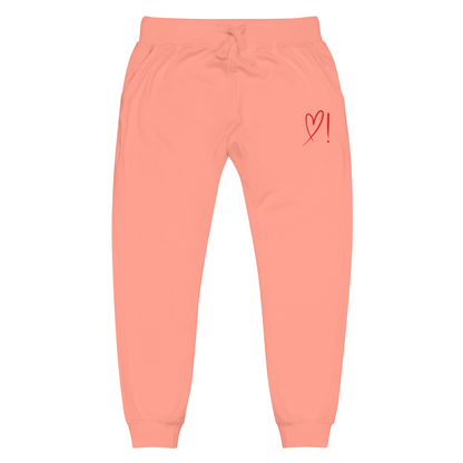 A pair of super soft ankle length unisex sweatpants, there are two pockets on the front and one pocket on the back right. There is a red heart with an exclamation point next to it embroidered on the front left pocket.