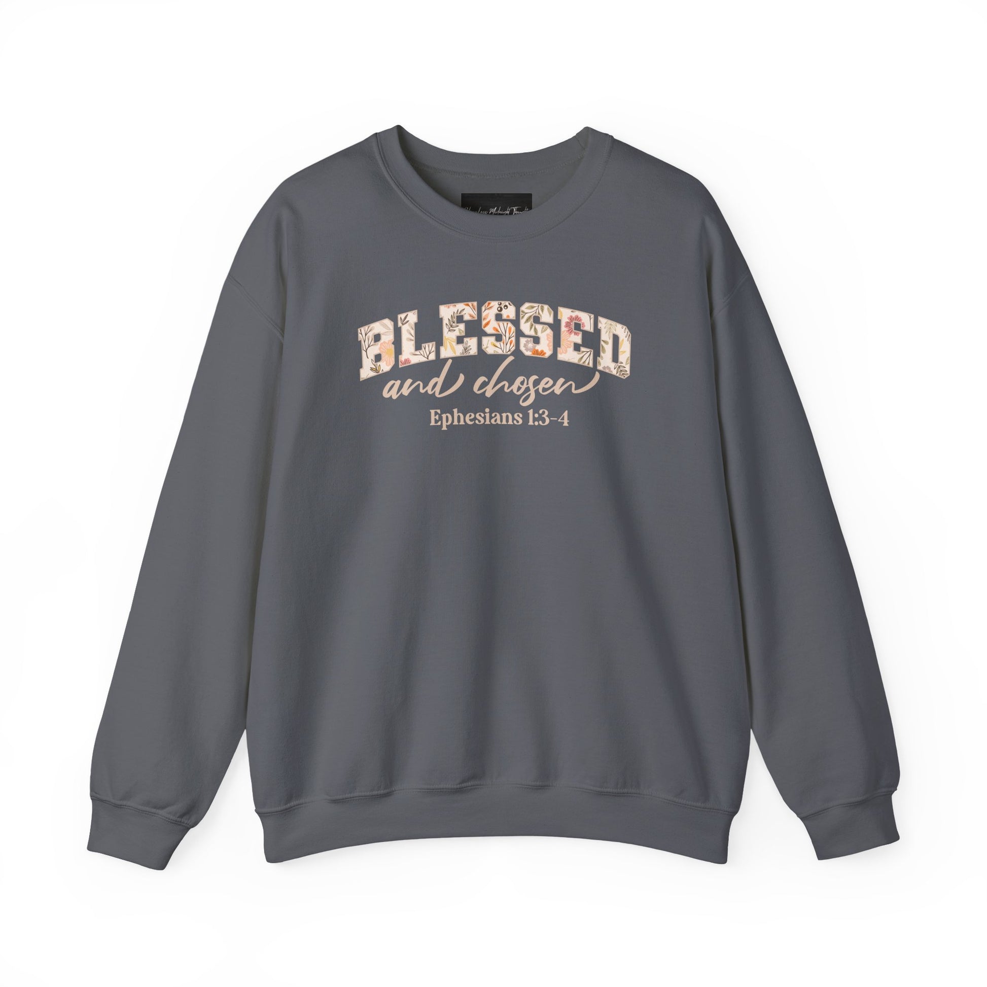 On the front of this custom Christian sweatshirt is the bible verse Blessed and Chosen Ephesians 1:3-4 with the word Blessed being in large bubble letters with a floral pattern on the inside of the letters.